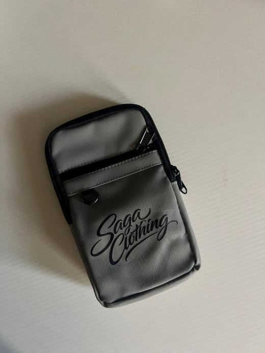 Saga Movement branded apparel folded on a light surface